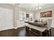 This dining room features a wooden table, bench seating, and a view from the windows at 117 Cottage Nw Walk, Cartersville, GA 30121
