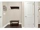 Entryway with a coat rack, bench, and a door, offering a practical and inviting space at 117 Cottage Nw Walk, Cartersville, GA 30121