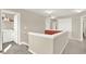 Upstairs hallway with carpet, access to laundry room and bedrooms at 117 Cottage Nw Walk, Cartersville, GA 30121