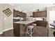 Modern kitchen featuring stainless steel appliances, granite countertops, and a central island with barstool seating at 117 Cottage Nw Walk, Cartersville, GA 30121