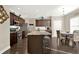Bright kitchen with stainless steel appliances, granite countertops, and an island, flowing into the dining area at 117 Cottage Nw Walk, Cartersville, GA 30121