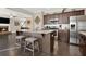 Open concept kitchen with a large island, stainless appliances, and seamless flow to the living area at 117 Cottage Nw Walk, Cartersville, GA 30121