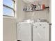 Functional laundry room with washer, dryer, shelving and window at 117 Cottage Nw Walk, Cartersville, GA 30121