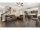 Cozy living room with dark wood floors, leather furniture, a staircase, and open floor concept at 117 Cottage Nw Walk, Cartersville, GA 30121