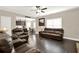 Cozy living room with dark wood floors, leather furniture, and open floor concept at 117 Cottage Nw Walk, Cartersville, GA 30121