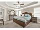 Spacious main bedroom with tray ceiling, fan, a queen bed, and two windows at 117 Cottage Nw Walk, Cartersville, GA 30121