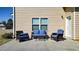 A patio with outdoor seating offers a spot to enjoy the outdoors at 117 Cottage Nw Walk, Cartersville, GA 30121