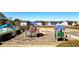 Community playground features multiple structures, swings, and slide for neighborhood children at 117 Cottage Nw Walk, Cartersville, GA 30121