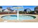 Community pool with zero-entry, clear water, and mushroom water feature with surrounding houses at 117 Cottage Nw Walk, Cartersville, GA 30121