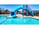A blue water slide leading into the community pool offers a fun recreational amenity for residents at 117 Cottage Nw Walk, Cartersville, GA 30121
