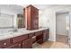 Bathroom vanity with double sinks, granite countertops, and dark wood cabinets at 12348 Hillcrest Dr, Hampton, GA 30228