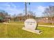 Exterior view of R.W. (Bobby) McBRAYER City Park sign with lawns, walking path and sport courts in the distance at 12348 Hillcrest Dr, Hampton, GA 30228