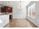 Bright dining area adjacent to the kitchen with hardwood floors and natural light at 12348 Hillcrest Dr, Hampton, GA 30228