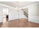 Open-concept dining area with hardwood floors and an elegant chandelier at 12348 Hillcrest Dr, Hampton, GA 30228