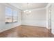 Dining room with hardwood floors, wainscoting and crown molding at 12348 Hillcrest Dr, Hampton, GA 30228