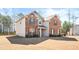 Brick home with vinyl siding and red shutters on a grassy lot at 12348 Hillcrest Dr, Hampton, GA 30228