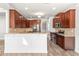 Kitchen area with lots of dark wood cabinetry, stainless steel appliances and breakfast bar at 12348 Hillcrest Dr, Hampton, GA 30228