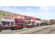 Street view showcasing local businesses, each with unique storefronts and a variety of architectural styles at 12348 Hillcrest Dr, Hampton, GA 30228