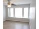 Bright bedroom with hardwood floors, neutral walls, and a large window for natural light at 545 Haymarket Ct, Riverdale, GA 30296