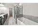 Spa-like bathroom with a soaking tub, separate shower, and stylish gray tile accents at 2474 Norwood Park Xing, Atlanta, GA 30340