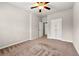 Neutral bedroom with a ceiling fan and double-door closet at 2474 Norwood Park Xing, Atlanta, GA 30340