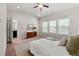 Spacious bedroom featuring a modern console table, natural light, and plush carpeting at 2474 Norwood Park Xing, Atlanta, GA 30340
