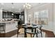 Cozy eat-in kitchen with dark floors, stylish lighting, and a bright window at 2474 Norwood Park Xing, Atlanta, GA 30340