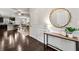 Inviting foyer with decorative mirror, console table, and dark hardwood floors at 2474 Norwood Park Xing, Atlanta, GA 30340