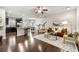 Open-concept living room featuring dark floors, stylish furnishings, and ample natural light at 2474 Norwood Park Xing, Atlanta, GA 30340