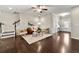Bright living room showcasing dark floors, staircase, and neutral wall color at 2474 Norwood Park Xing, Atlanta, GA 30340