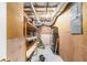 Unfinished basement with exposed ductwork, pegboard walls, and shelving offers ample storage space at 930 Camden Hill Ct, Lawrenceville, GA 30046