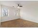 Bright and airy bedroom with neutral walls, two windows, carpet and a ceiling fan at 930 Camden Hill Ct, Lawrenceville, GA 30046