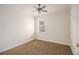 Cozy bedroom featuring neutral walls, trim, carpet and a ceiling fan at 930 Camden Hill Ct, Lawrenceville, GA 30046