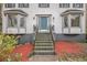 Inviting front entrance with a stylish blue door and well-maintained landscaping at 930 Camden Hill Ct, Lawrenceville, GA 30046