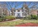 Charming two-story home with dormer windows, a well-manicured lawn and mature trees at 930 Camden Hill Ct, Lawrenceville, GA 30046