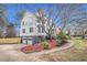 A charming two-story home with a two-car garage, manicured lawn, and a welcoming walkway at 930 Camden Hill Ct, Lawrenceville, GA 30046