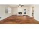 Open living room with hardwood floors and a cozy fireplace at 930 Camden Hill Ct, Lawrenceville, GA 30046