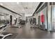 Well-equipped gym with various workout machines, free weights, and ample space for exercise at 943 Peachtree Ne St # 1603, Atlanta, GA 30309