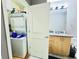 The laundry room has a stacked washer and dryer adjacent to the bathroom at 943 Peachtree Ne St # 1603, Atlanta, GA 30309