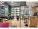 Bright living room with large windows and city views plus stylish decor, including a modern kitchen island at 943 Peachtree Ne St # 1603, Atlanta, GA 30309