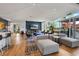 Cozy lounge area with comfortable seating, a large TV, and access to an outdoor patio at 943 Peachtree Ne St # 1603, Atlanta, GA 30309