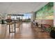 Bright lounge area featuring tall chairs, dining space, large windows and modern decor at 943 Peachtree Ne St # 1603, Atlanta, GA 30309