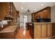 A kitchen features oak cabinets, granite countertops, and stainless steel appliances at 11765 Mountain Laurel Dr, Roswell, GA 30075