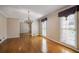 A dining room showcases hardwood floors, elegant molding, and abundant natural light at 11765 Mountain Laurel Dr, Roswell, GA 30075