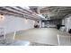 Spacious unfinished basement with exposed ceiling, mini-kitchen and white-painted walls at 187 Bowden Rd, Ellenwood, GA 30294