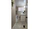 Bathroom view featuring a toilet, shelving, vanity, and window at 187 Bowden Rd, Ellenwood, GA 30294