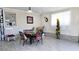 Bright dining area features brick accents, neutral tile flooring, and decoratives at 187 Bowden Rd, Ellenwood, GA 30294