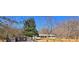 Well-maintained ranch home featuring gated entry, large trees, and a cozy, inviting atmosphere at 187 Bowden Rd, Ellenwood, GA 30294