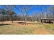 Spacious outdoor area featuring a picnic shelter and rustic seating, ideal for enjoying the surrounding landscape at 187 Bowden Rd, Ellenwood, GA 30294