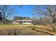Charming ranch style home with level lawn and mature trees, offering a peaceful setting at 187 Bowden Rd, Ellenwood, GA 30294
